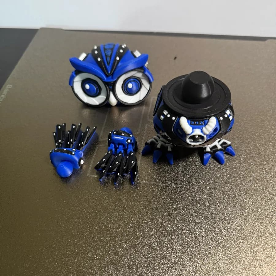 Small printed fidget characters on a desk