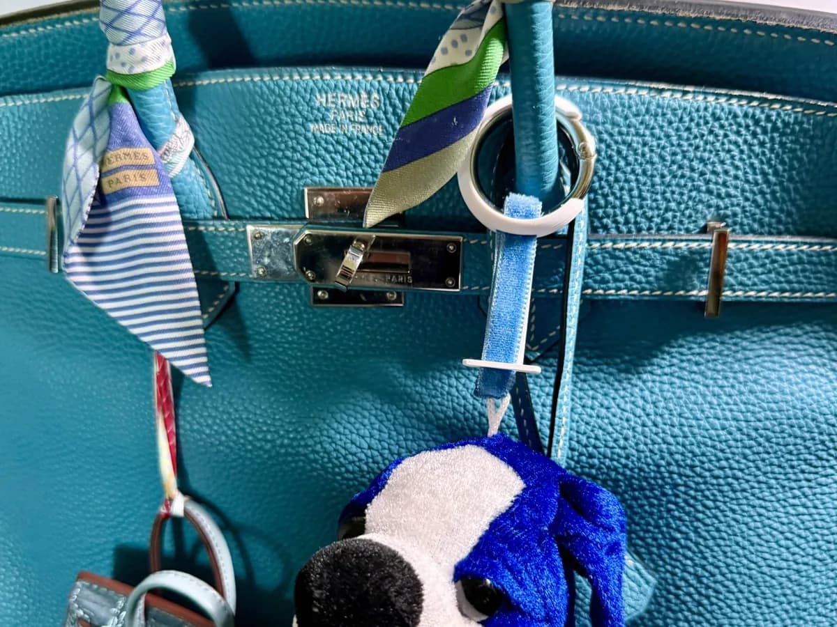 Close-up of printed bag charms and clips