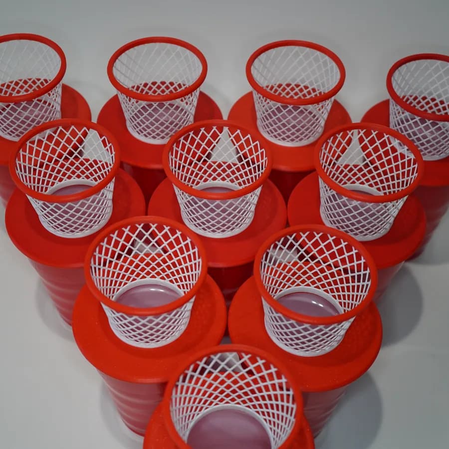 A tray of red mini basketball hoop cups